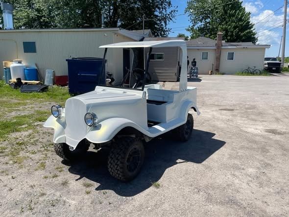 Finished custom cart in white outside the shop