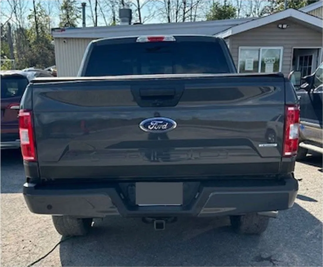 The same Ford F-150 rear with new tailgate and straight bumper